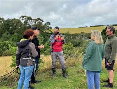 Smelling the yarrow on the Nature Walk with Ken Neal