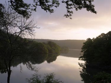 Watch the sun rise over the creek from the bedrooms