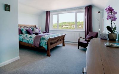 King size bed, with lovely sea and coastal path views.