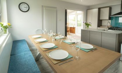 Open plan dining area. Comfortable bench seating and sea views.