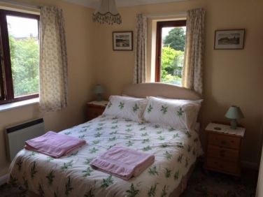 Bedroom 2 with views of font garden and village Conservation Area
