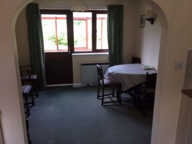 Dining area from kitchen with extendable table.