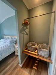 A walk in wardrobe for the main bedroom