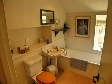 Bathroom with bath (including hand-held shower attachment)