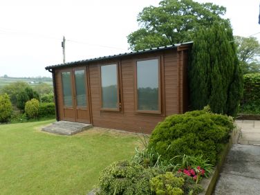 Log cabin housing Hot Tub.
