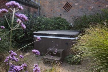 Hot tub in fragrant enclosed garden