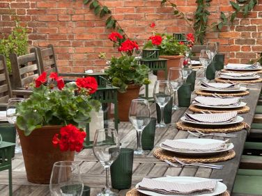Outside dining area to seat 18 - 24  in sheltered spot located next to the kitchen