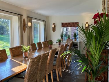 Dining area which comfortably seats 18 overlooking the huge gardens and grounds of 2 acres