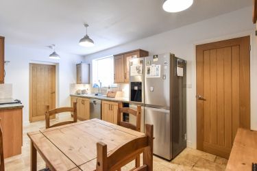 Spacious Kitchen with American Style Fridge Freezer