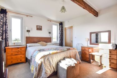 Master Bedroom with King size bed and Ensuite shower room and view to South & West