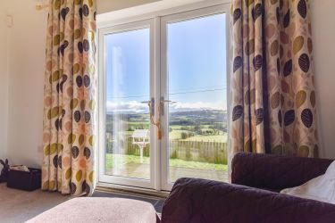 Lounge Patio Doors opening onto South facing decking and garden