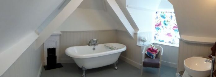 Bathroom with roll top bath
