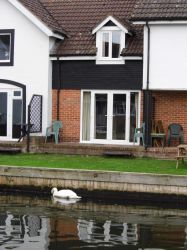 Private terrace opens to lawn and private mooring right outside the door