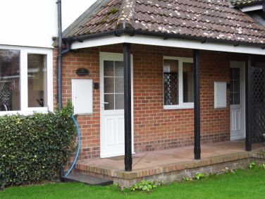 Covered, well-lit entrance to Albion and Wherry cottage.