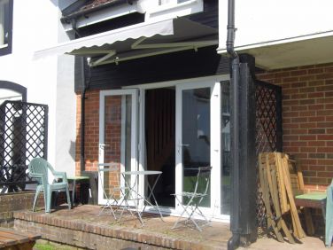Your private terrace has wind-out awning against sun or rain