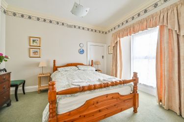 Gorran apartment bedroom with king sized bed