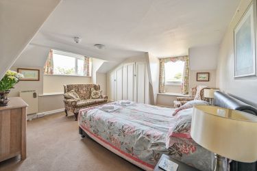 Heligan apartment main bedroom now with king sized bed