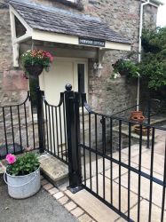 Front door and gated patio area