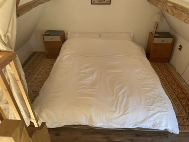 Double bed on mezzanine floor in the main Barn