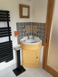 Hand-made tiles complement the annex bathroom