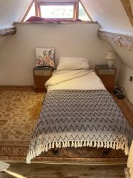 Single bed in the mezzanine floor of the main barn, up a spiral staircase