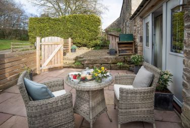Enclosed and private patio area with comfortable seating