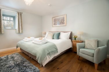Spacious and luxurious bedroom with super king bed and Egyptian cotton bedding