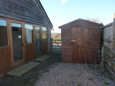 Lockable shed within garden