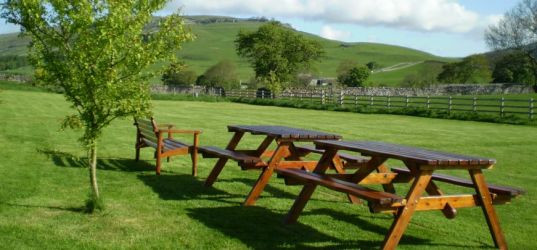 Extensive grounds with seating areas.