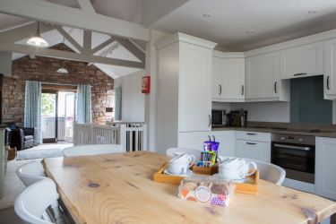Kitchen with integrated appliances including dishwasher