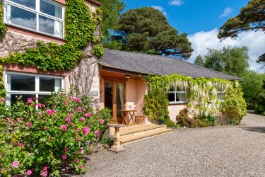 Front patio entrance and kitchen window to the left looking north