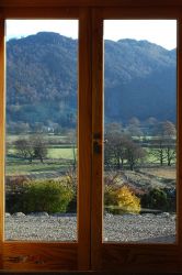 View from front French doors over the patio looking east