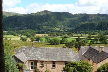 View over Cocklety How Stable Loft from our fell side woodland