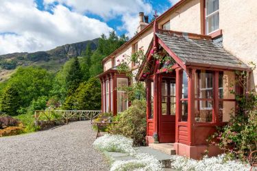 Manesty Band's porch and bay window looking s.w.at Blea Crag in the summer