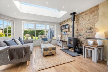Garden room with TV/ Stove nice seating over looking garden