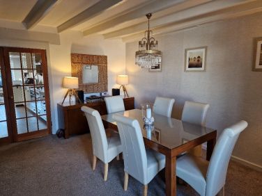 Dining Room seats 8 with glass chandelier
