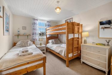 Bunk Room with 3 full sized single beds, TV & DVD player