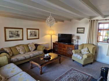 Main lounge with smart TV, WIFI, Games, DVDS seats 7 & Stove