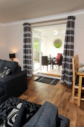 French doors leading to Al fresco dining area and garden