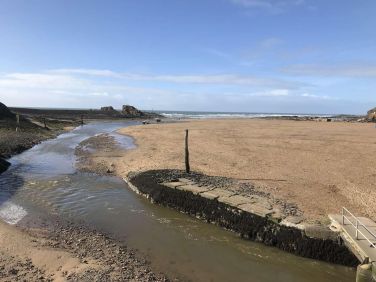 River Neet empties into the sea at Summerleaze beach, Bude