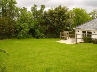 Completely private back garden. Table & chaira on terrace, further picnic table on the lawn.