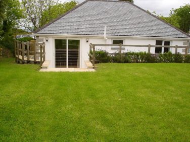 BBQ, swing ball game and children's garden toys in the garden store box.