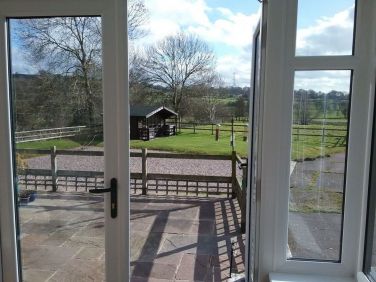 Open views from the conservatory also showing the gym which has an excellent collection of equipment