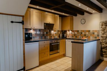 Use locally sourced food to cook up a meal in this well equipped kitchen.