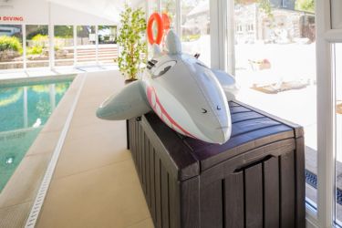 Inflatables and tots in swimming pool