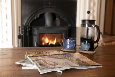 Curl up in front of the cosy log-burning stove in the lounge with a good book or magazine.