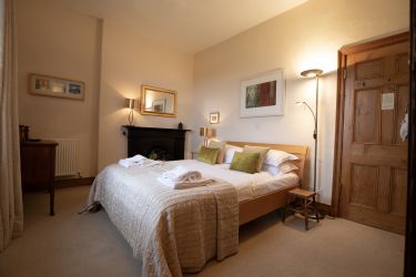 Bedroom two has a king-sized bed and combines restful colours with luxurious silk furnishings.