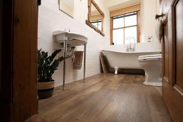 The family bathroom has a feature antique roll-top bath.