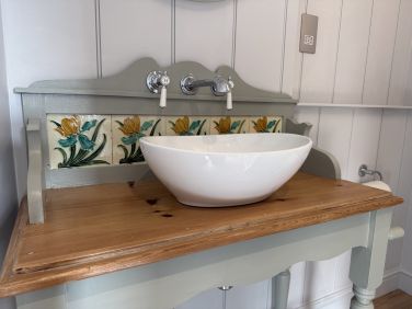 Upcycled washstand in the ensuite shower room.