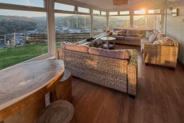 The sun room enjoys both sunrise and sunset with panoramic views of the village and countryside.